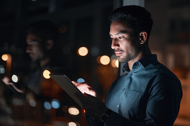 businessman reading on Ipad